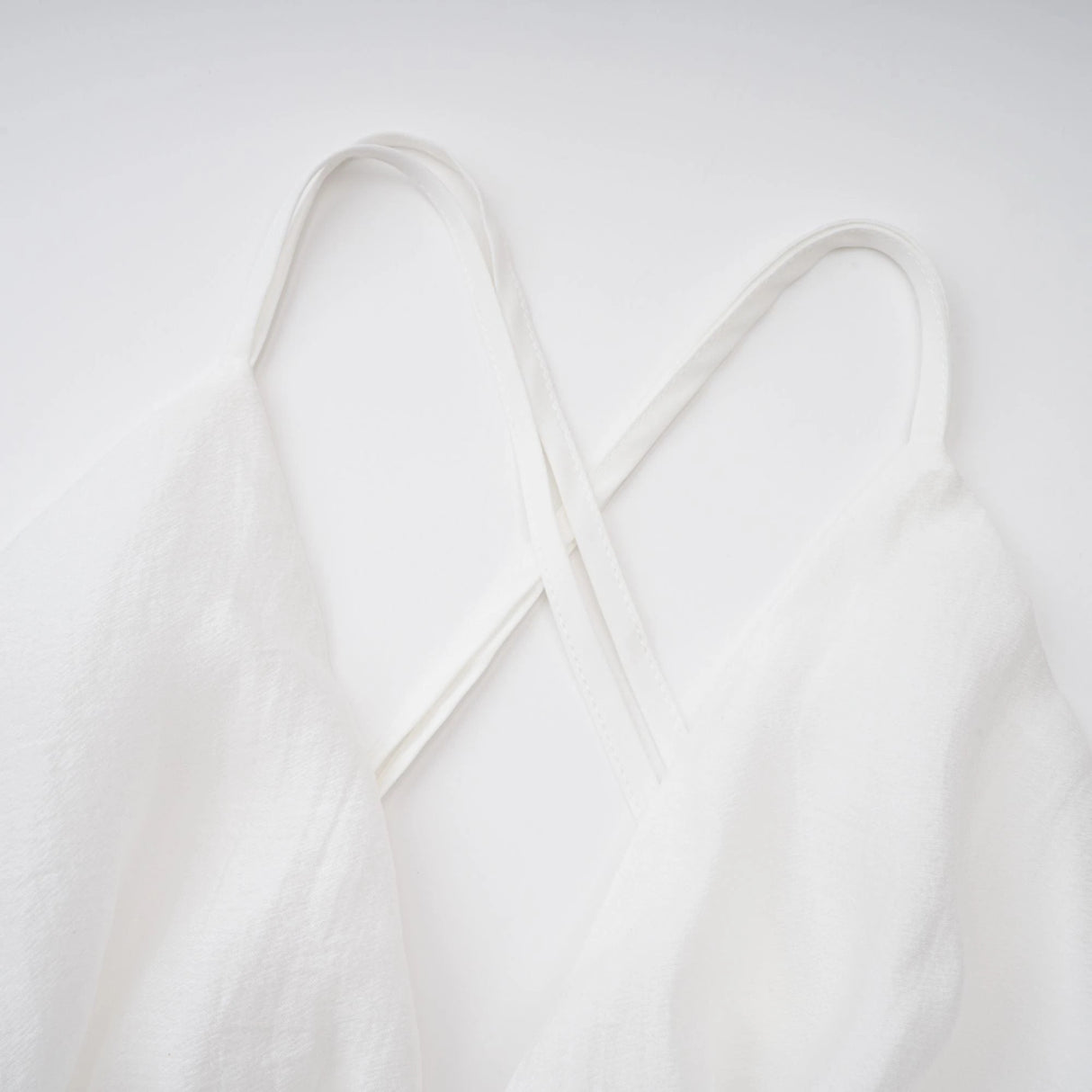 Quincie white shirred flounced mini dress