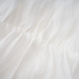 Quincie white shirred flounced mini dress